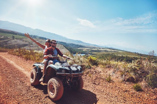 Young,Couple,On,An,Off,Road,Adventure.,Man,Driving,Quad